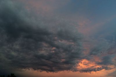 Low angle view of dramatic sky during sunset