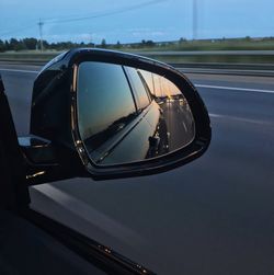 Reflection of car on side-view mirror