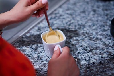 Midsection of person holding ice cream cone