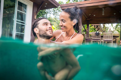 Portrait of smiling man in swimming pool