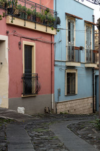 Alley by houses in town