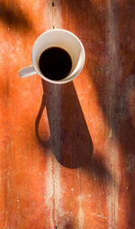 High angle view of black coffee on table