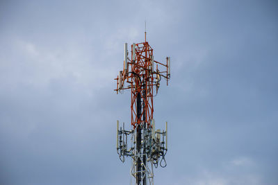 Low angle view of communications tower against sky