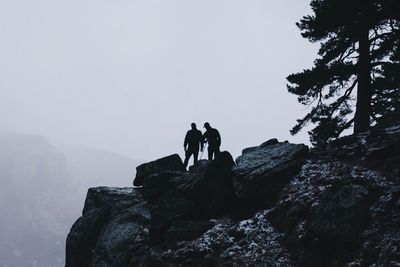 Full length of woman standing on rock