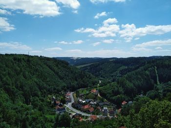 High angle view of houses on landscape against sky