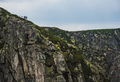 Low angle view of rocky landscape against sky