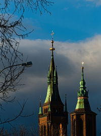 Low angle view of building against cloudy sky