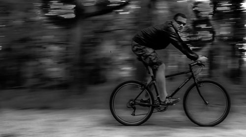 Man riding bicycle on street