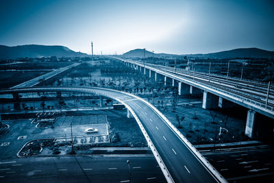 High angle view of bridge in city against sky