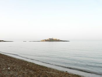 Scenic view of sea against clear sky