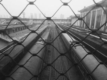 Suspension bridge seen through chainlink fence