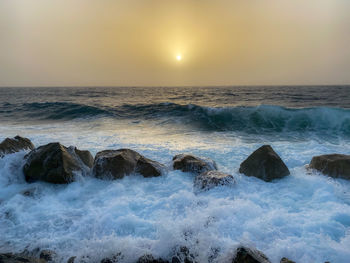 Scenic view of sea against sky during sunset