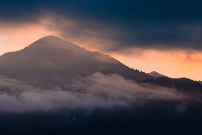 Scenic view of mountains against sky during sunset