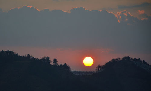Scenic view of silhouette landscape against romantic sky at sunset