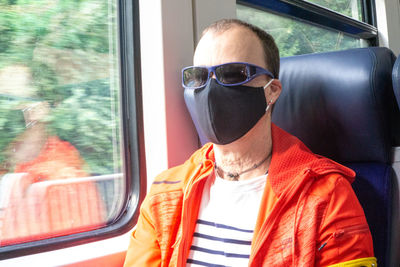 Portrait of man in train