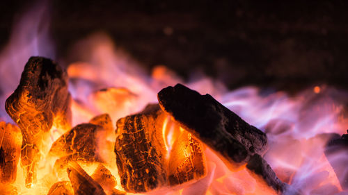 Close-up of fire burning at night