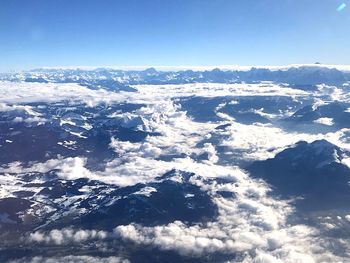 Aerial view of snowcapped mountain against sky