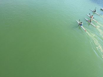 High angle view of people on kayak in sea