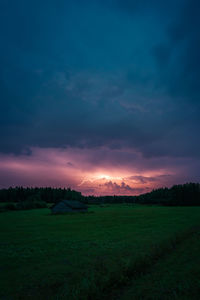 Scenic view of field against sky during sunset