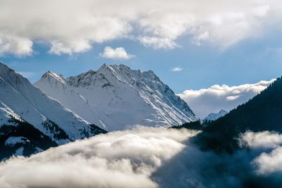 Scenic view of snowcapped mountains against sky