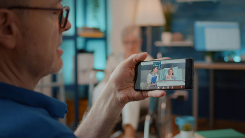 Close up of man doing video call