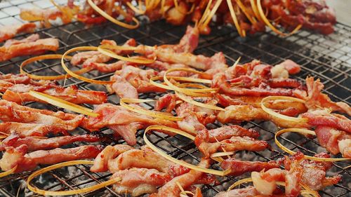 Close-up of meat on barbecue grill