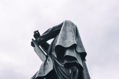 Low angle view of statue against sky