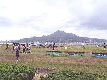 People on field against sky