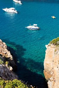 High angle view of sailboats in sea