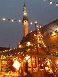 Low angle view of illuminated tower at night