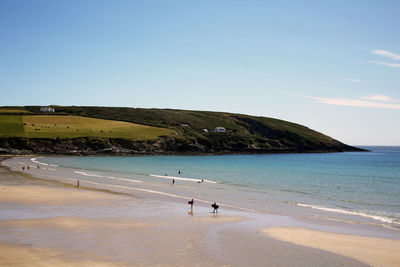 Scenic view of sea against clear blue sky