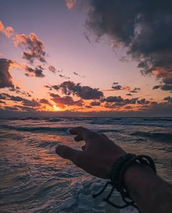 Beach against sky during sunset