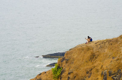 Rear view of man standing on beach