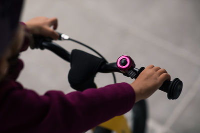 Close-up of woman hand holding pink camera
