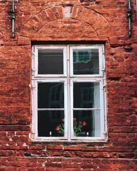 Low angle view of window on old building