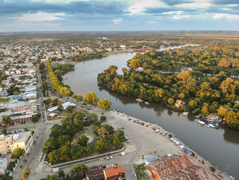 High angle view of river amidst buildings in city