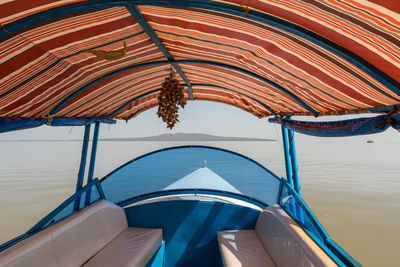 Tilt image of parasol against sea