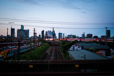 High angle view of train in city against sky