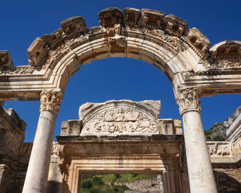 Low angle view of old ruins against clear sky