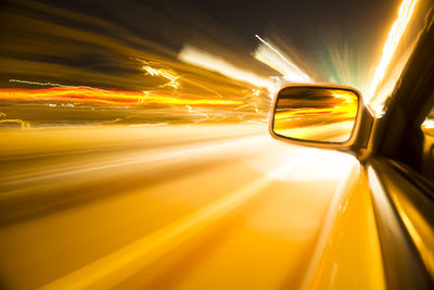 Blurred motion of illuminated car at night