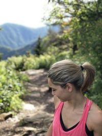 Portrait of woman looking at mountains