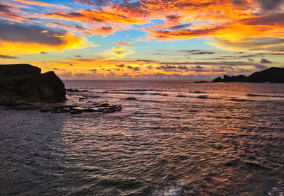 Scenic view of sea against sky during sunset
