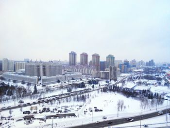 View of cityscape against sky during winter