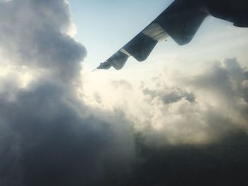 Low angle view of airplane flying in sky