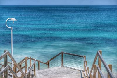 Scenic view of sea against blue sky