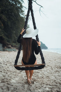 Rear view of woman on beach