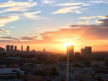 High angle view of city at sunset