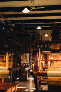 Illuminated pendant lights hanging in factory