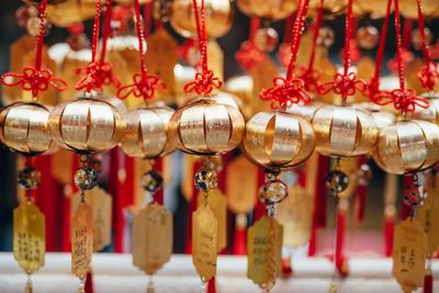 Close-up of bell hanging at market stall