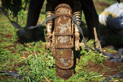 Close-up of old motorcycle tire on field